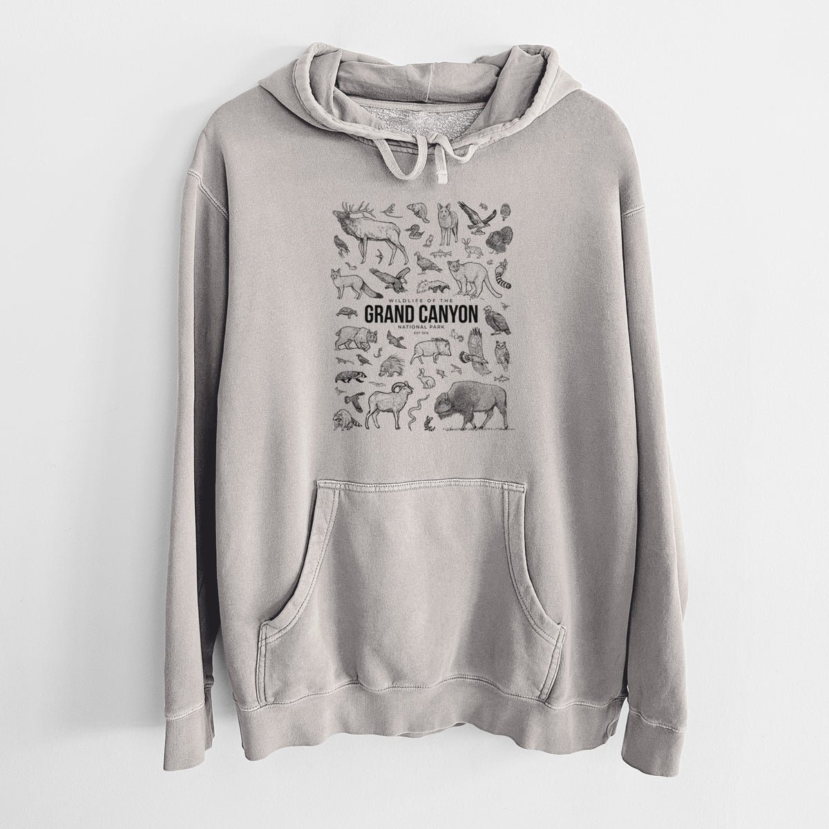 Cement grey pigment dyed hoodie laid flat, printed with a collection of black ink wildlife illustrations surrounding the words Grand Canyon National Park.