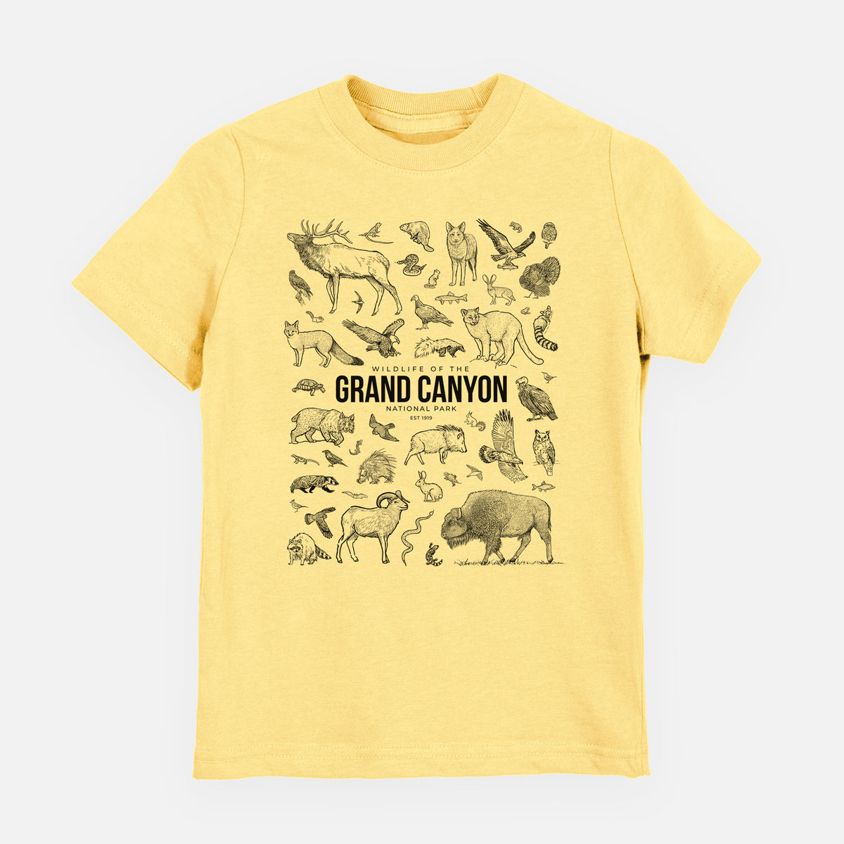 Butter yellow youth t-shirt laid flat, printed with a collection of black ink wildlife illustrations surrounding the words Grand Canyon National Park.