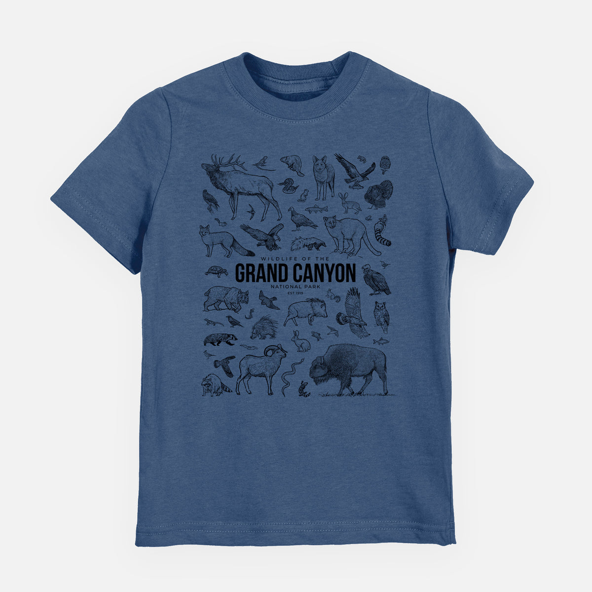 Indigo blue youth t-shirt laid flat, printed with a collection of black ink wildlife illustrations surrounding the words Grand Canyon National Park.