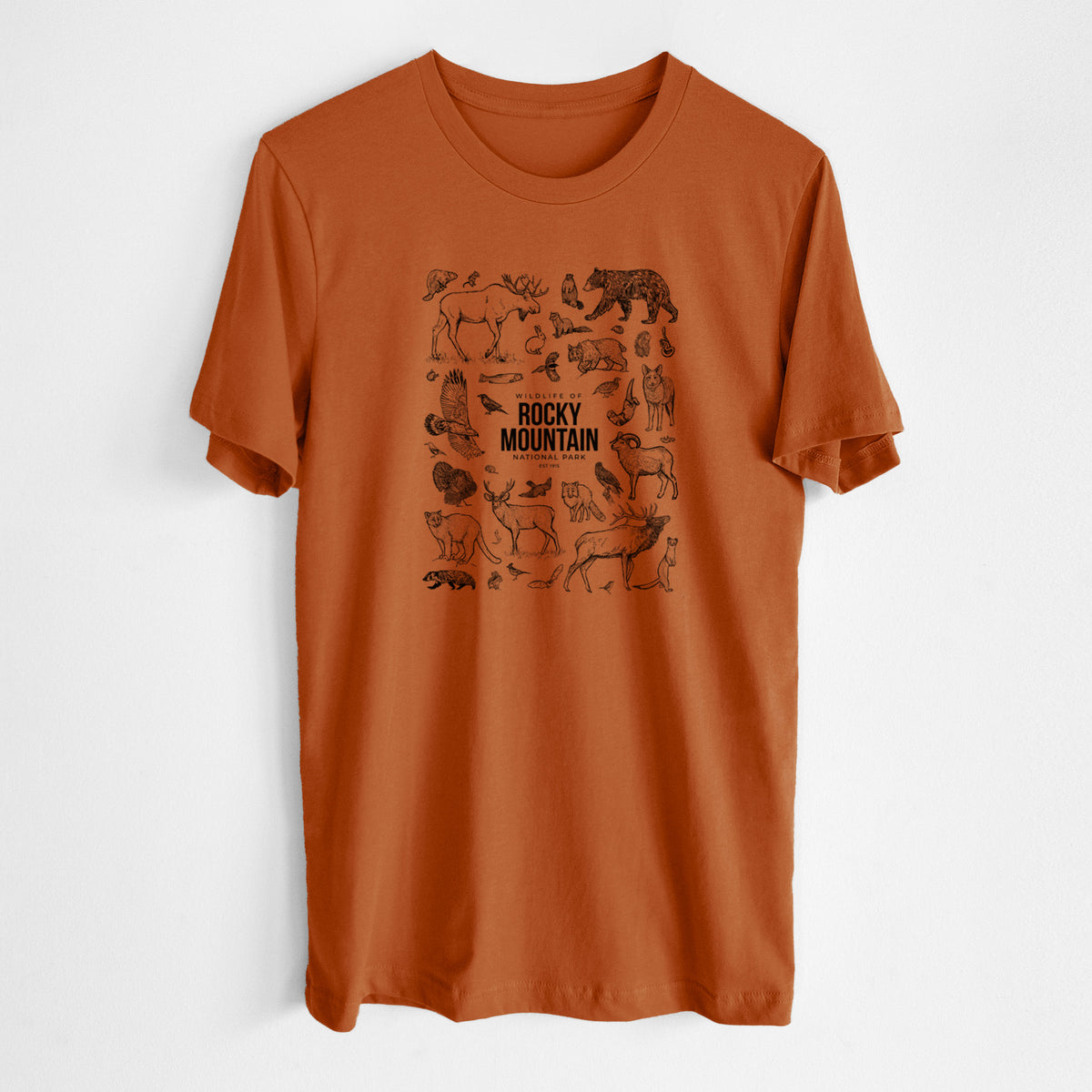 Autumn lightweight cotton t-shirt laid flat, printed with a collection of black ink wildlife illustrations surrounding the words Rocky Mountain National Park.