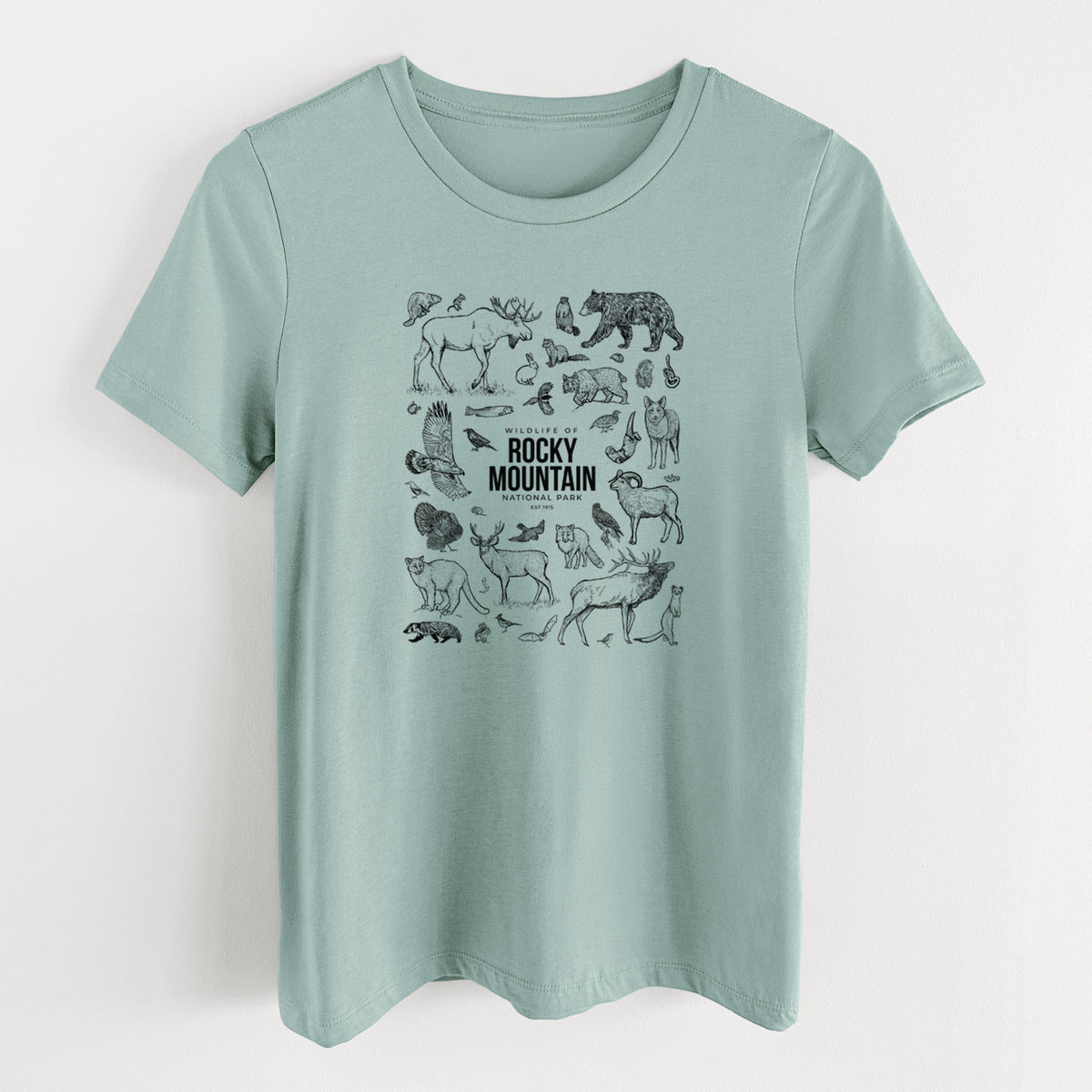Dusty blue women's relaxed fit cotton t-shirt laid flat, printed with a collection of black ink wildlife illustrations surrounding the words Rocky Mountain National Park.
