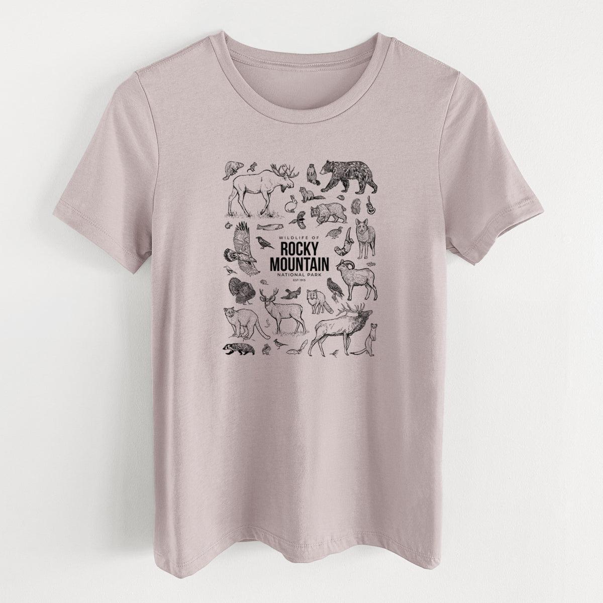 Pink gravel women's relaxed fit cotton t-shirt laid flat, printed with a collection of black ink wildlife illustrations surrounding the words Rocky Mountain National Park.