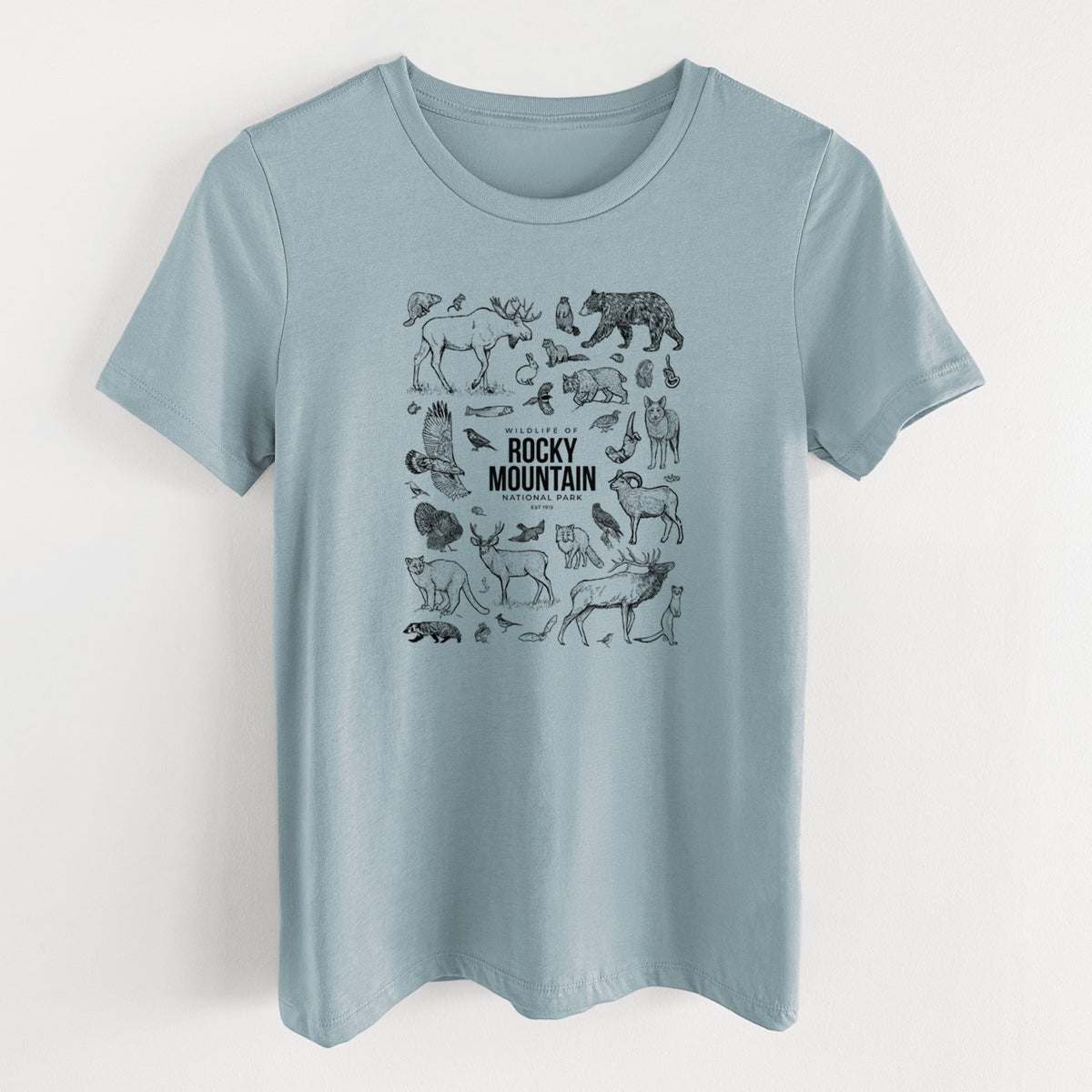Vintage denim women's relaxed fit cotton t-shirt laid flat, printed with a collection of black ink wildlife illustrations surrounding the words Rocky Mountain National Park.