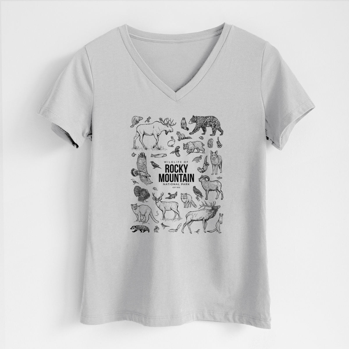 Lunar grey women's relaxed fit cotton V-neck t-shirt laid flat, printed with a collection of black ink wildlife illustrations surrounding the words Rocky Mountain National Park.