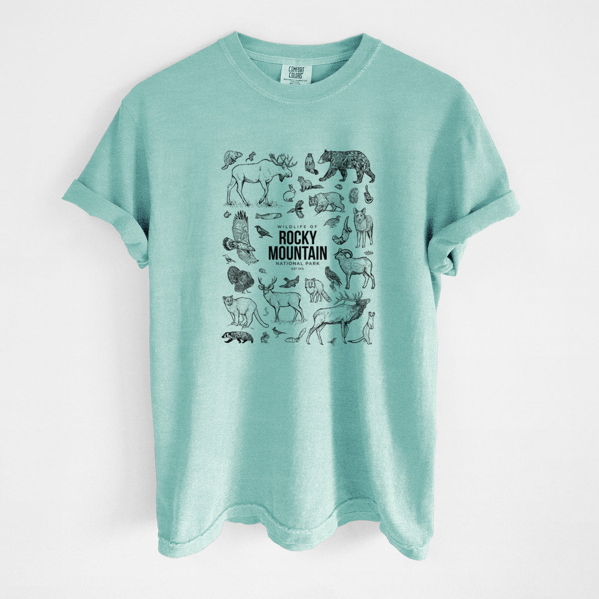 Chalky mint Comfort Colors t-shirt laid flat, printed with a collection of black ink wildlife illustrations surrounding the words Rocky Mountain National Park.