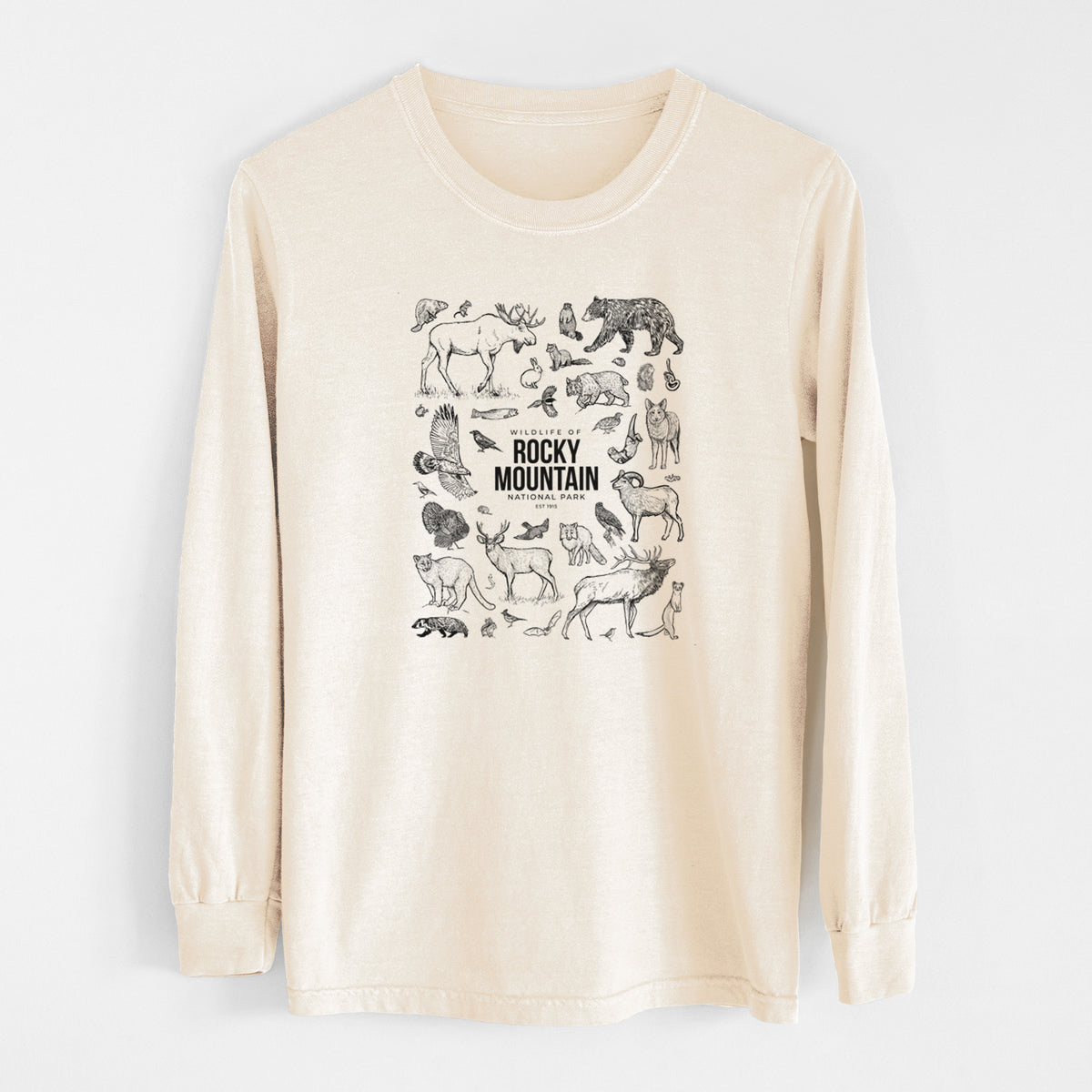 Ivory Comfort Colors long sleeve shirt laid flat, printed with a collection of black ink wildlife illustrations surrounding the words Rocky Mountain National Park.