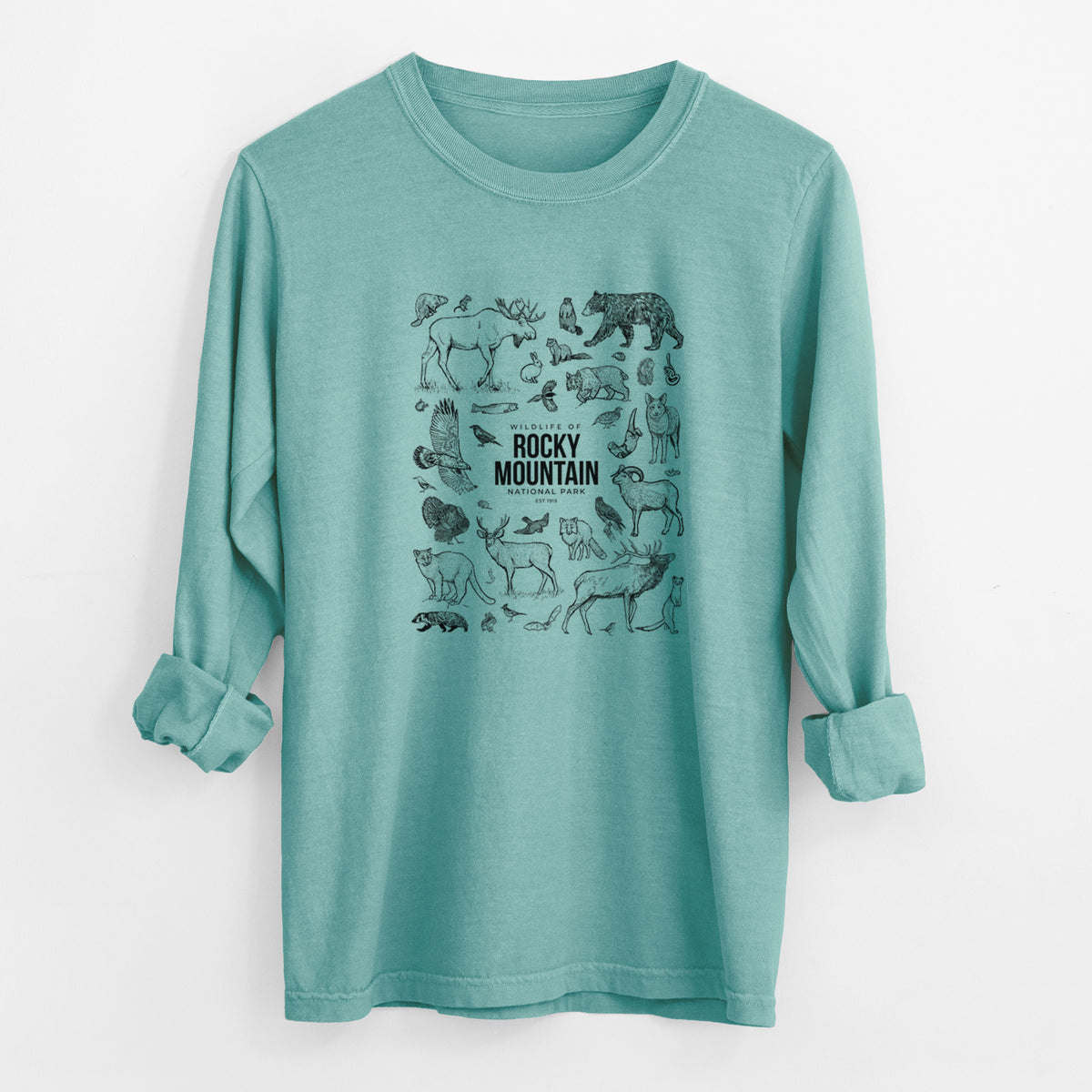 Reef green Comfort Colors long sleeve shirt laid flat with the cuffs rolled, printed with a collection of black ink wildlife illustrations surrounding the words Rocky Mountain National Park.