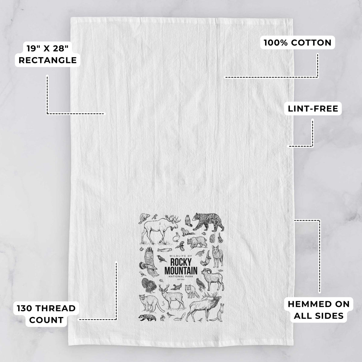White tea towel printed with a collection of black ink wildlife illustrations surrounding the words Rocky Mountain National Park, with feature labels: 19 by 28 inch rectangle, 100% cotton, lint-free, 130 thread count, hemmed on all sides.