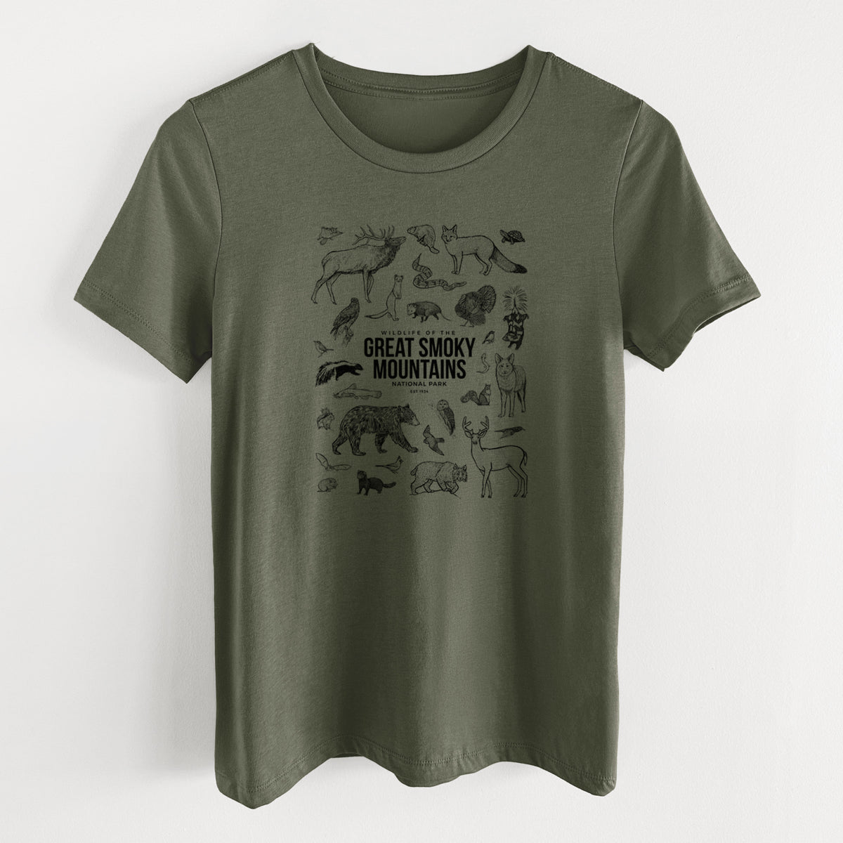Military green women's relaxed fit cotton t-shirt laid flat, printed with a collection of black ink wildlife illustrations surrounding the words Great Smoky Mountains National Park.