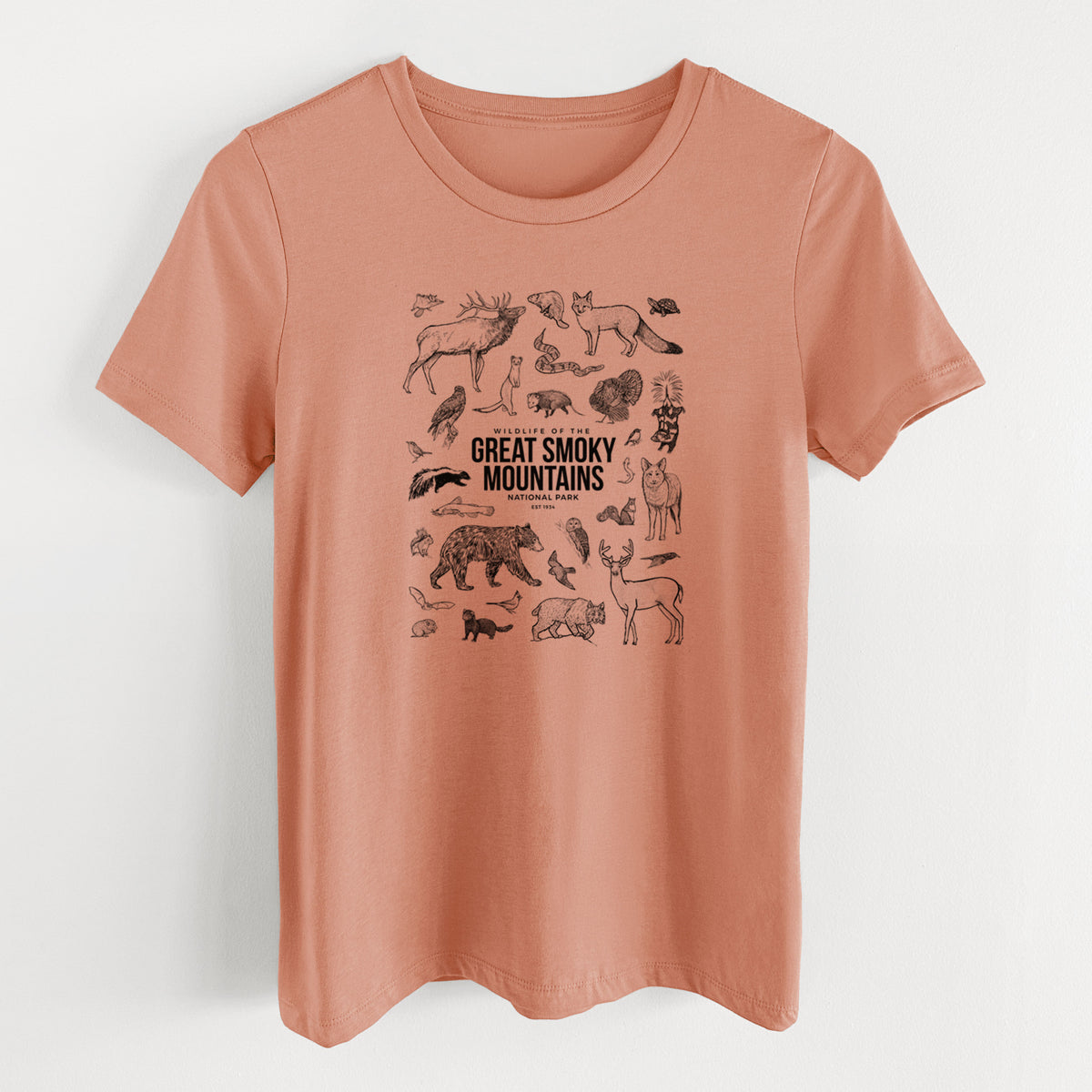 Terracotta orange women's relaxed fit cotton t-shirt laid flat, printed with a collection of black ink wildlife illustrations surrounding the words Great Smoky Mountains National Park.