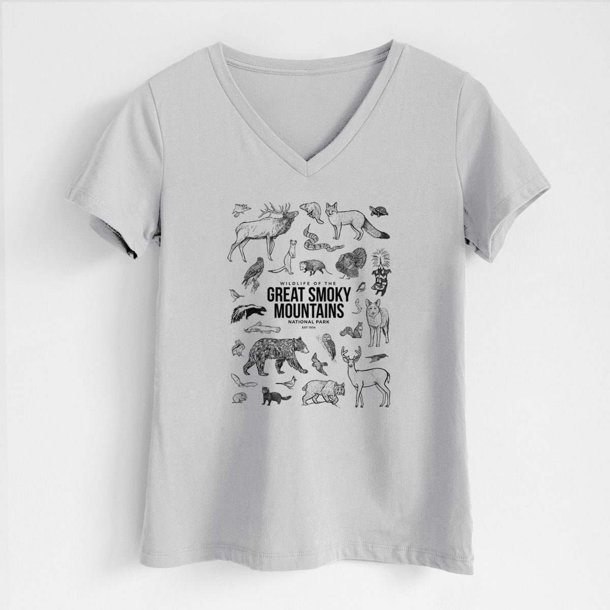 Lunar grey women's relaxed fit cotton V-neck t-shirt laid flat, printed with a collection of black ink wildlife illustrations surrounding the words Great Smoky Mountains National Park.