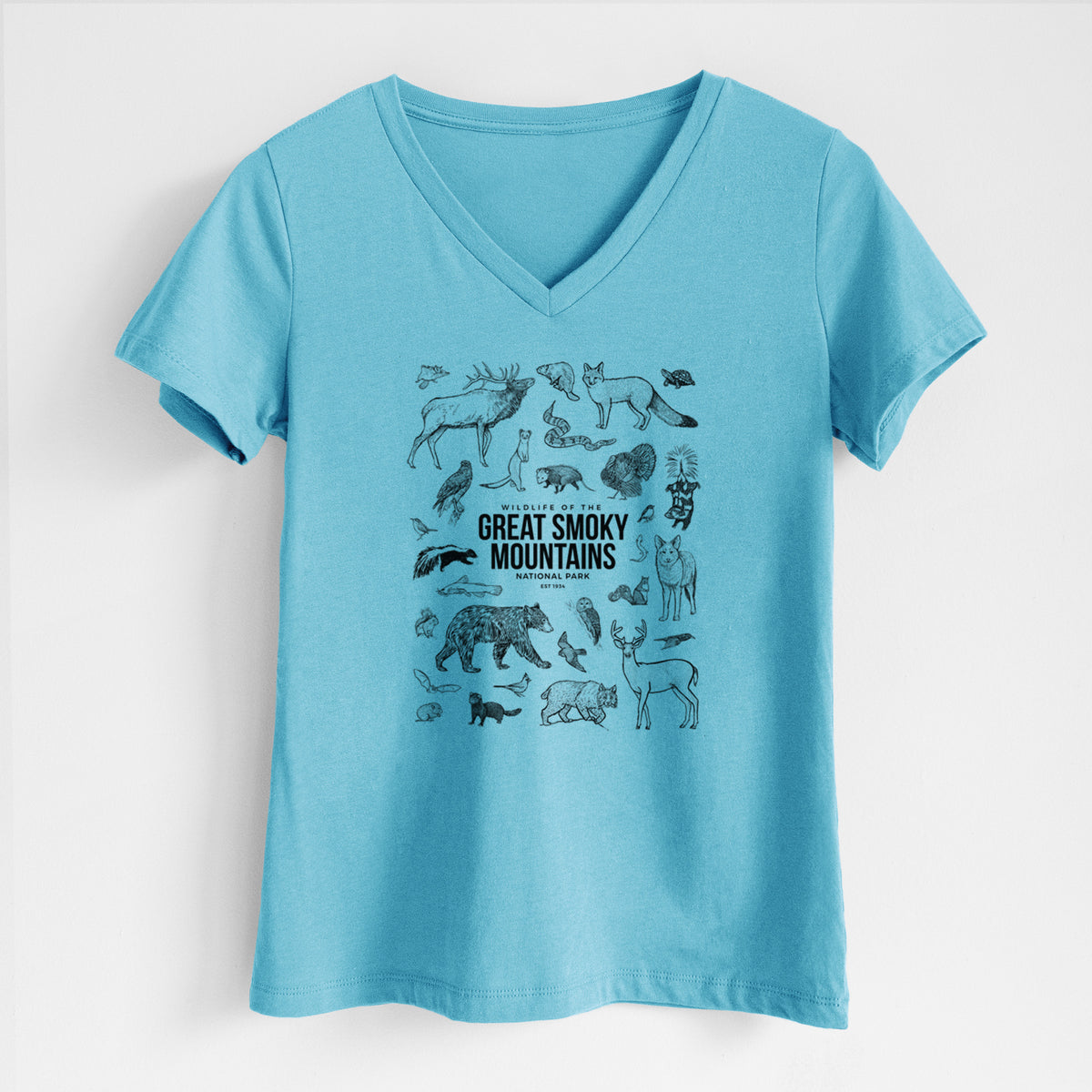 Turquoise women's relaxed fit cotton V-neck t-shirt laid flat, printed with a collection of black ink wildlife illustrations surrounding the words Great Smoky Mountains National Park.