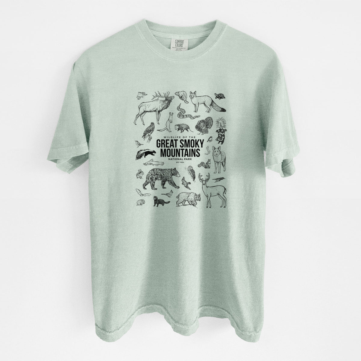 Bay green Comfort Colors t-shirt laid flat, printed with a collection of black ink wildlife illustrations surrounding the words Great Smoky Mountains National Park.