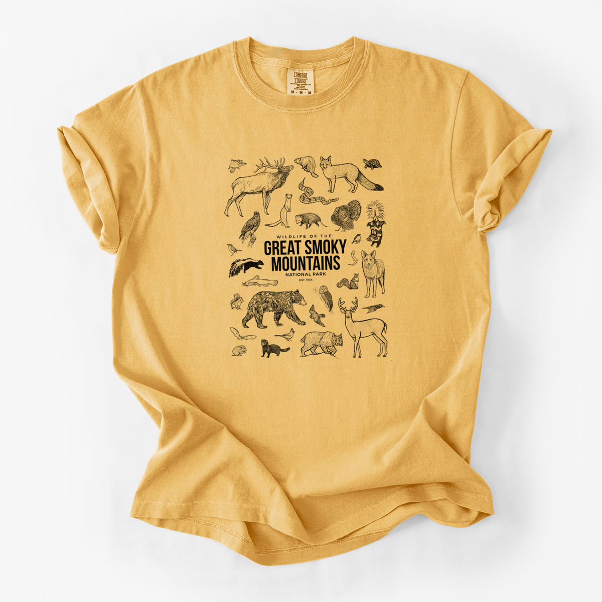 Golden wheat yellow Comfort Colors t-shirt laid flat, printed with a collection of black ink wildlife illustrations surrounding the words Great Smoky Mountains National Park.