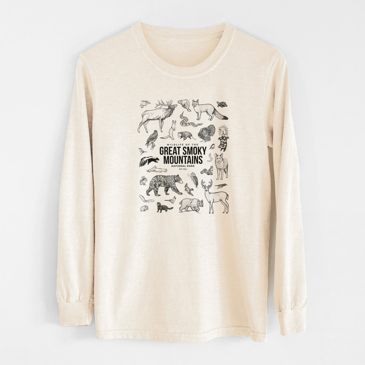 Ivory Comfort Colors long sleeve shirt laid flat, printed with a collection of black ink wildlife illustrations surrounding the words Great Smoky Mountains National Park.