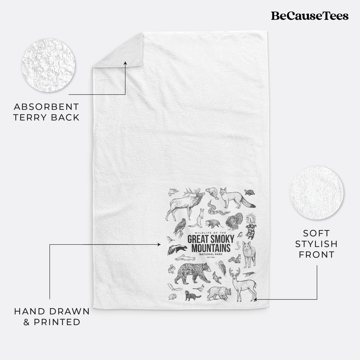 White hand towel printed with a collection of black ink wildlife illustrations surrounding the words Great Smoky Mountains National Park.