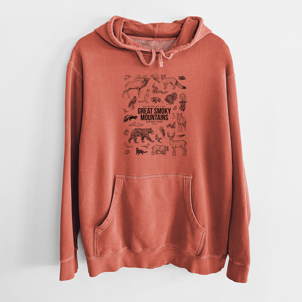 Amber orange pigment dyed hoodie laid flat, printed with a collection of black ink wildlife illustrations surrounding the words Great Smoky Mountains National Park.