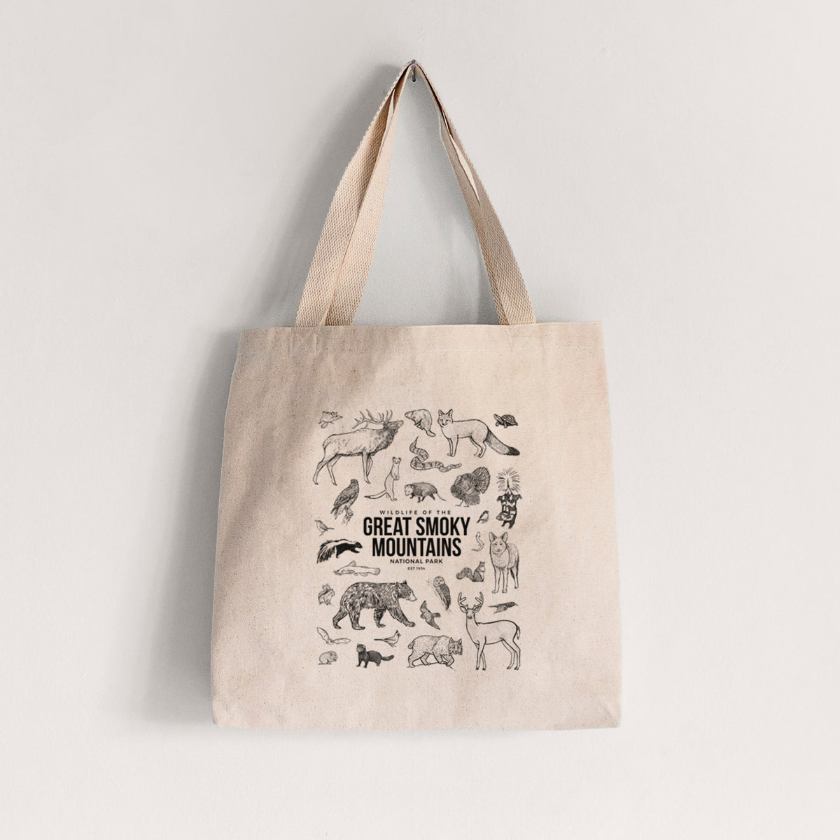 Natural canvas tote bag printed with a collection of black ink wildlife illustrations surrounding the words Great Smoky Mountains National Park.