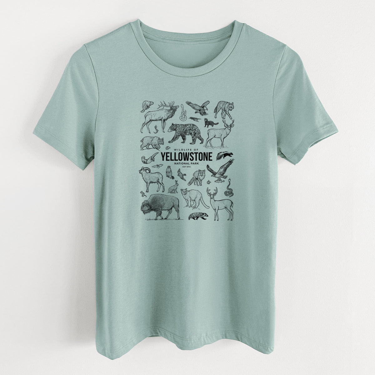 Dusty blue women's relaxed fit cotton t-shirt laid flat, printed with a collection of black ink wildlife illustrations surrounding the words Yellowstone National Park.