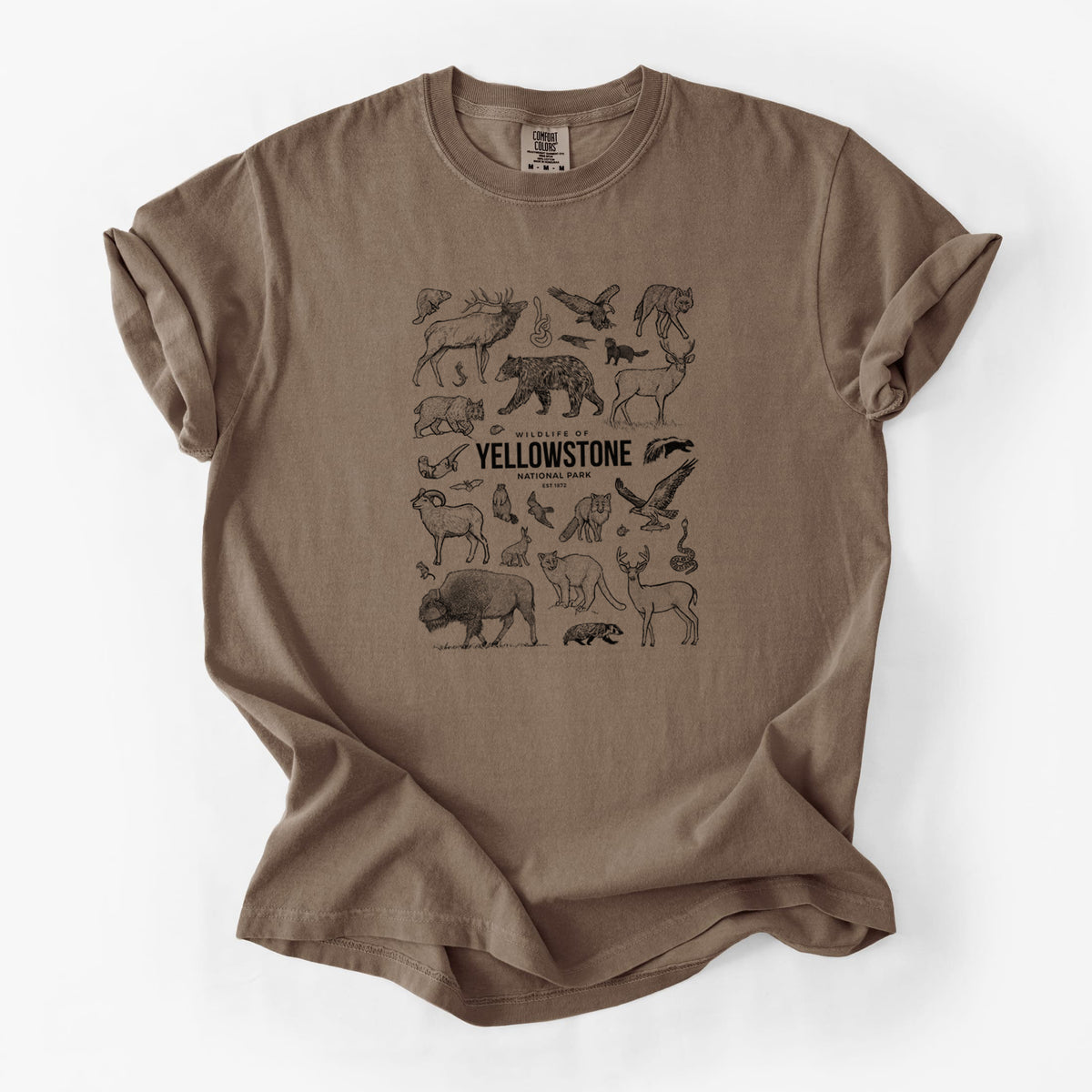 Espresso brown Comfort Colors t-shirt laid flat, printed with a collection of black ink wildlife illustrations surrounding the words Yellowstone National Park.