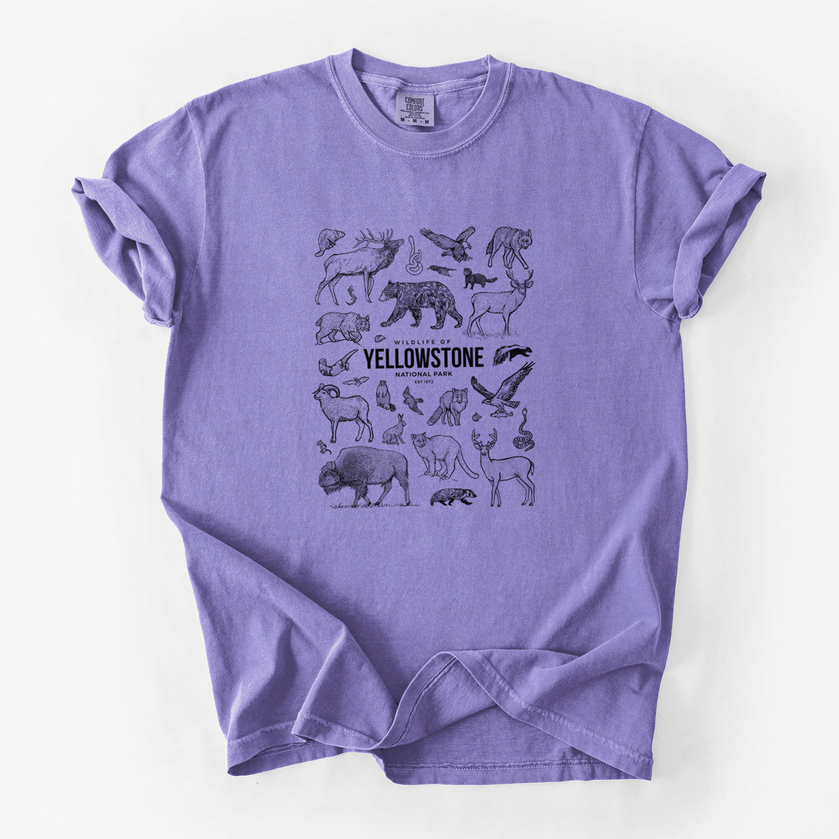 Violet purple Comfort Colors t-shirt laid flat, printed with a collection of black ink wildlife illustrations surrounding the words Yellowstone National Park.