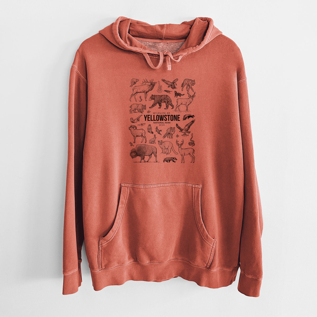 Amber orange pigment dyed hoodie laid flat, printed with a collection of black ink wildlife illustrations surrounding the words Yellowstone National Park.