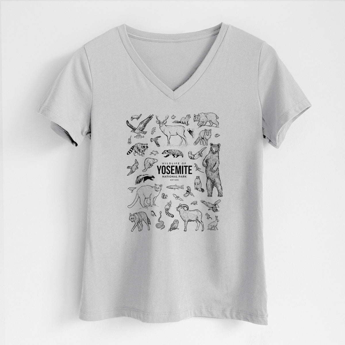 Lunar grey women's relaxed fit cotton V-neck t-shirt laid flat, printed with a collection of black ink wildlife illustrations surrounding the words Yosemite National Park.