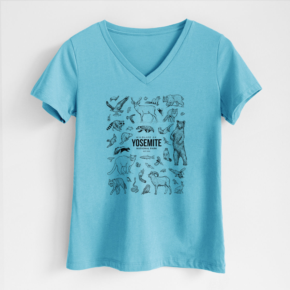 Turquoise women's relaxed fit cotton V-neck t-shirt laid flat, printed with a collection of black ink wildlife illustrations surrounding the words Yosemite National Park.
