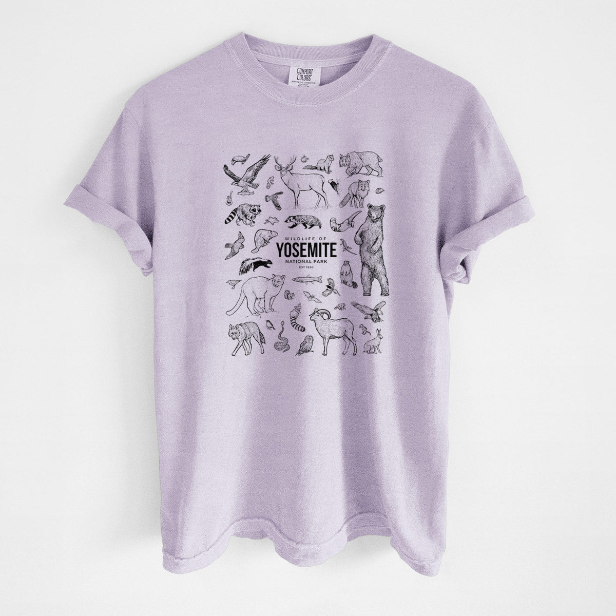 Orchid purple Comfort Colors t-shirt laid flat, printed with a collection of black ink wildlife illustrations surrounding the words Yosemite National Park.