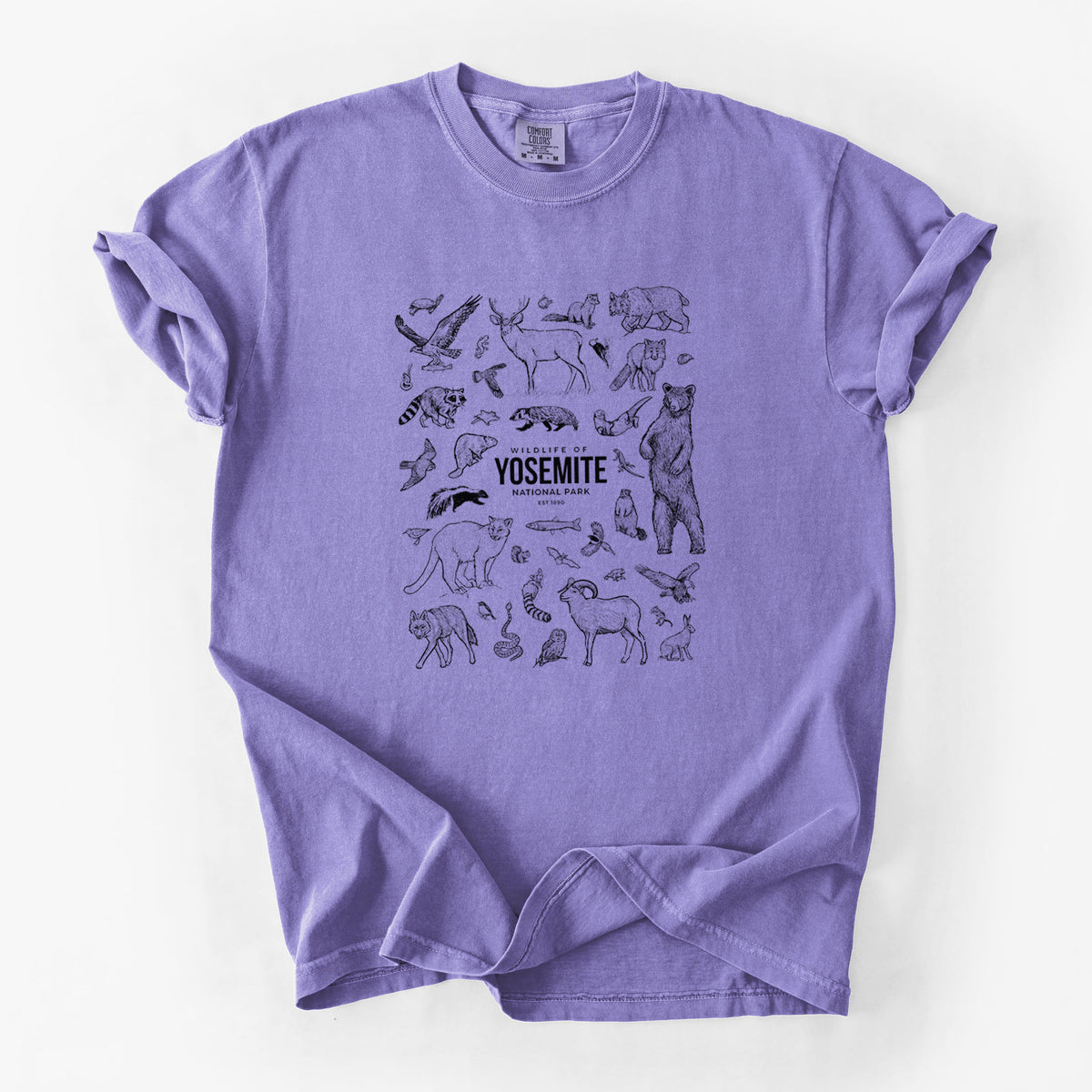 Violet purple Comfort Colors t-shirt laid flat, printed with a collection of black ink wildlife illustrations surrounding the words Yosemite National Park.