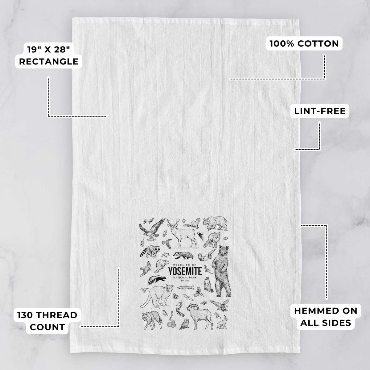 White tea towel printed with a collection of black ink wildlife illustrations surrounding the words Yosemite National Park, with feature labels: 19 by 28 inch rectangle, 100% cotton, lint-free, 130 thread count, hemmed on all sides.