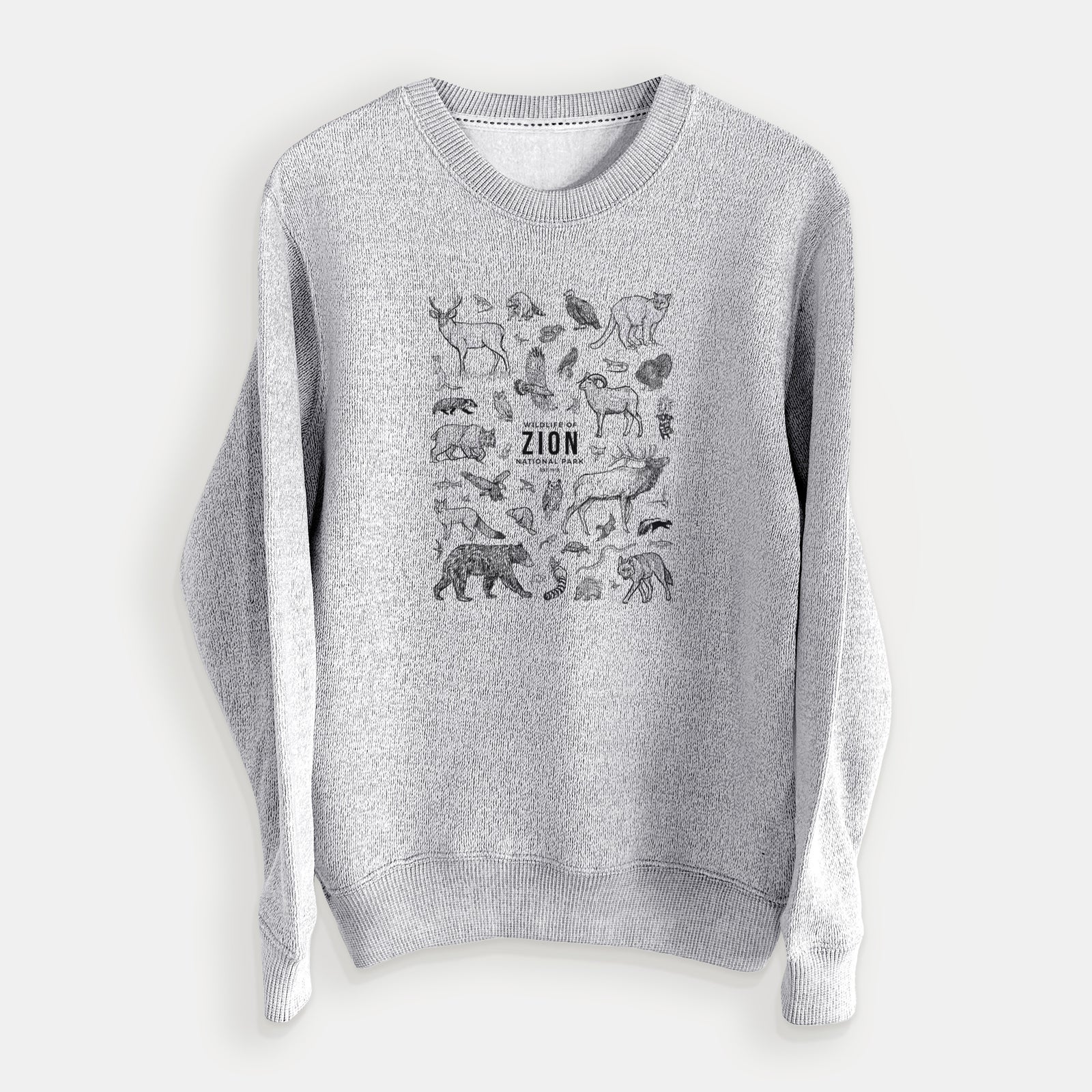 Salt and pepper knit sweatshirt laid flat, printed with a collection of black ink wildlife illustrations surrounding the words Zion National Park.