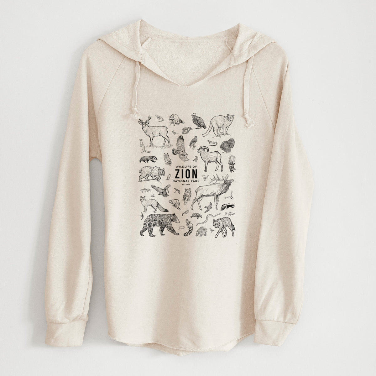 Bone cream women's Cali Wave hooded sweatshirt laid flat, printed with a collection of black ink wildlife illustrations surrounding the words Zion National Park.