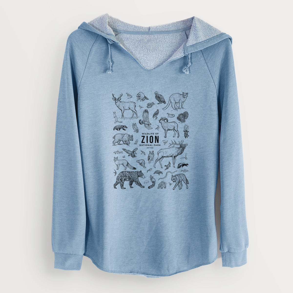Misty blue women's Cali Wave hooded sweatshirt laid flat, printed with a collection of black ink wildlife illustrations surrounding the words Zion National Park.