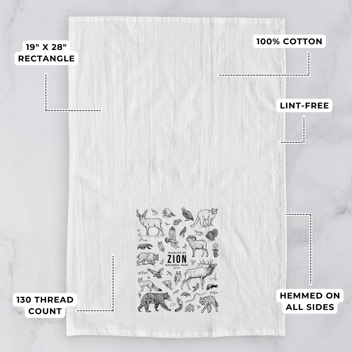 White tea towel printed with a collection of black ink wildlife illustrations surrounding the words Zion National Park, with feature labels: 19 by 28 inch rectangle, 100% cotton, lint-free, 130 thread count, hemmed on all sides.
