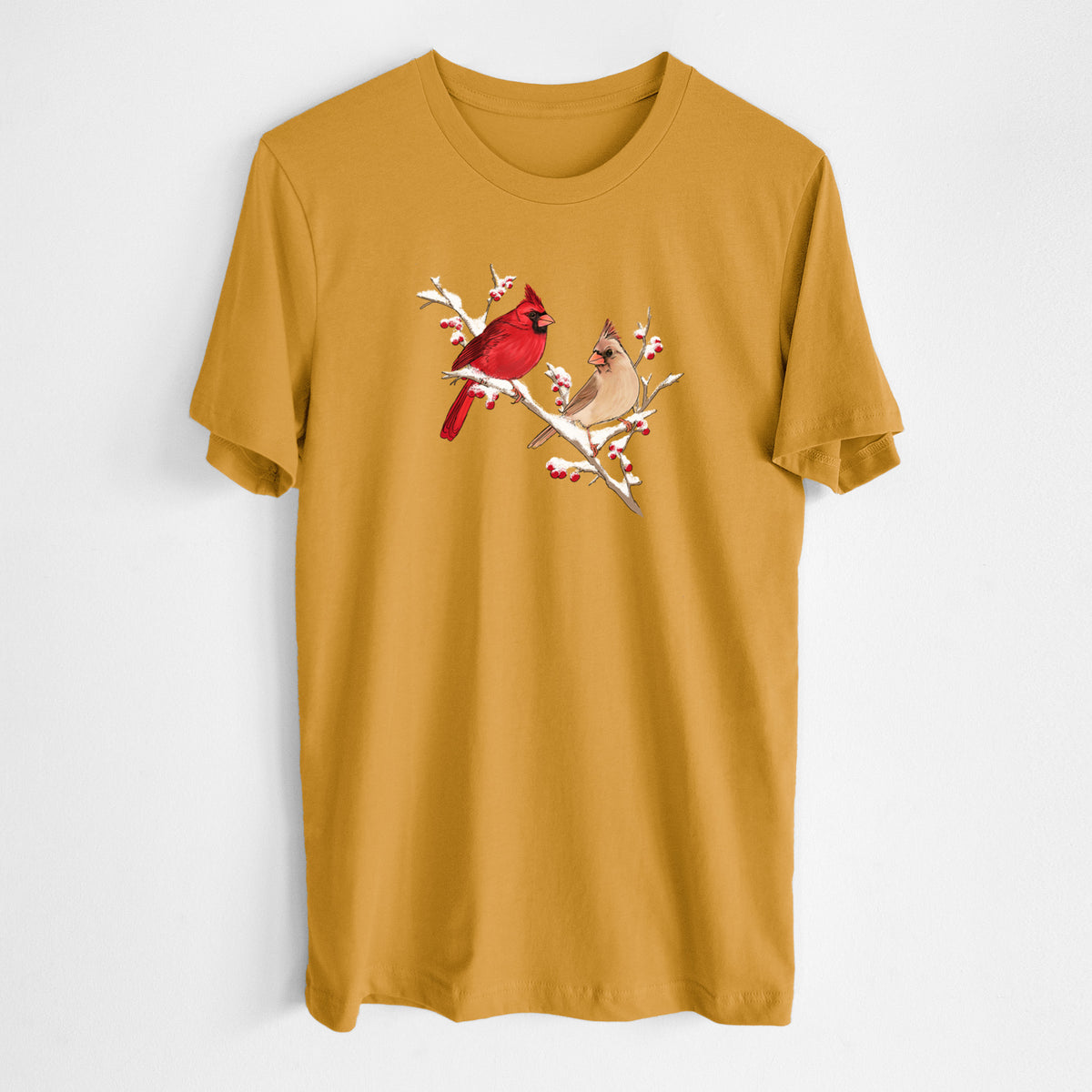 Honeycomb yellow lightweight cotton t-shirt laid flat, printed with a full-color illustration of a male and female northern cardinal perched on a snowy branch with red berries.