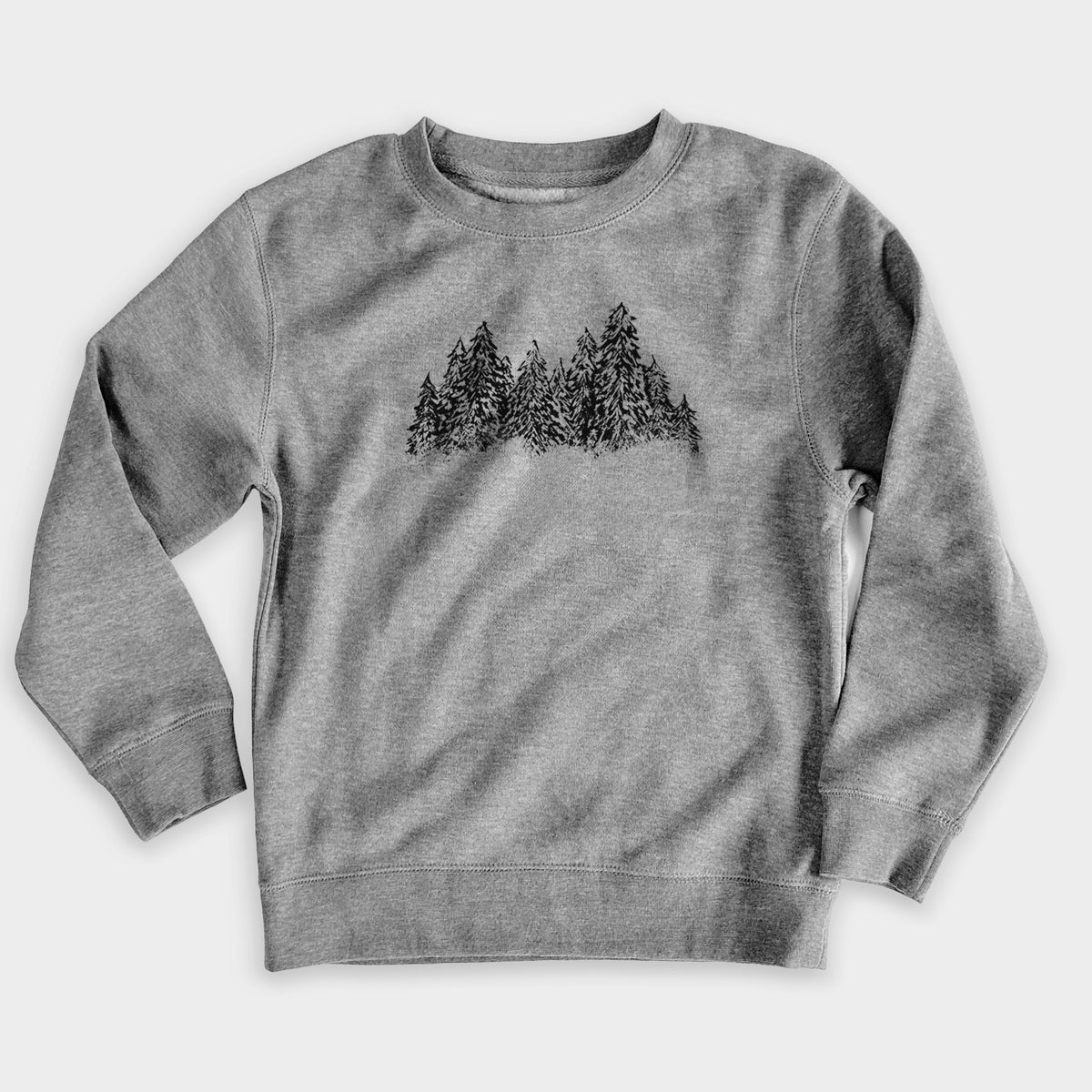 Nickel grey youth crewneck sweatshirt laid flat, printed with a black ink illustration of a row of snow-dusted evergreen trees.