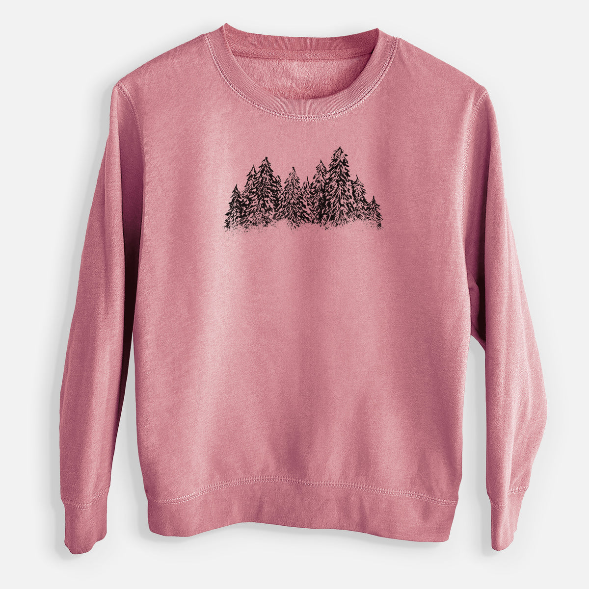 Mauve pink youth crewneck sweatshirt laid flat, printed with a black ink illustration of a row of snow-dusted evergreen trees.