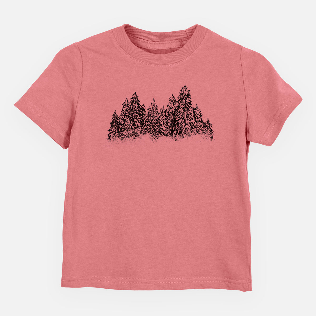 Mauve pink toddler t-shirt laid flat, printed with a black ink illustration of a row of snow-dusted evergreen trees.