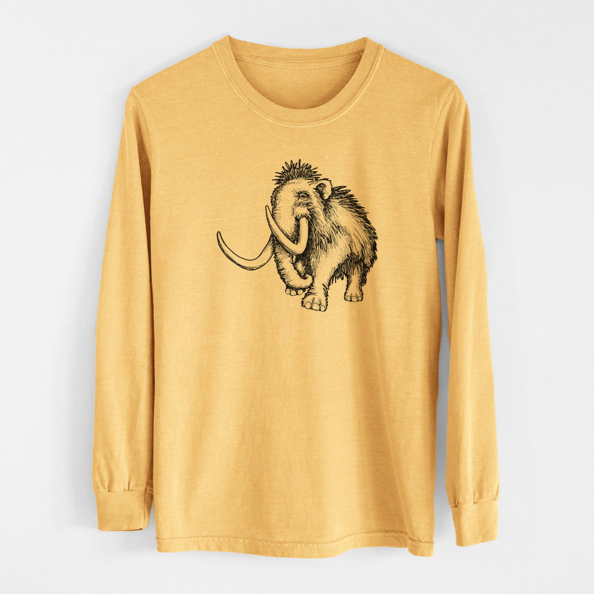 Golden wheat yellow Comfort Colors long sleeve shirt laid flat, printed with a black ink illustration of a woolly mammoth with long curved tusks.