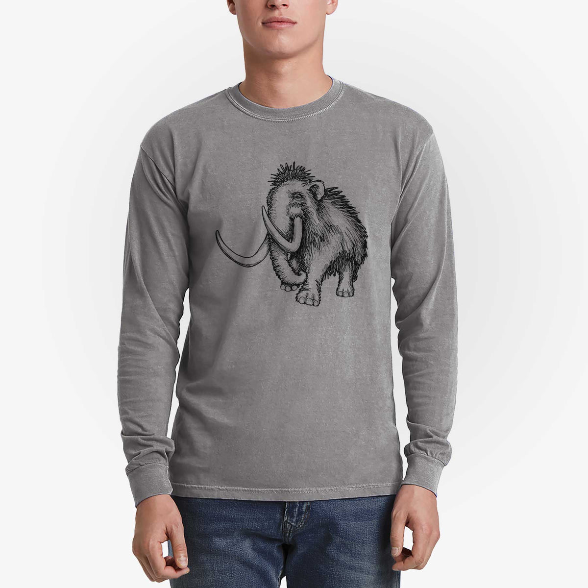 Man wearing a grey Comfort Colors long sleeve shirt printed with a black ink illustration of a woolly mammoth with long curved tusks.