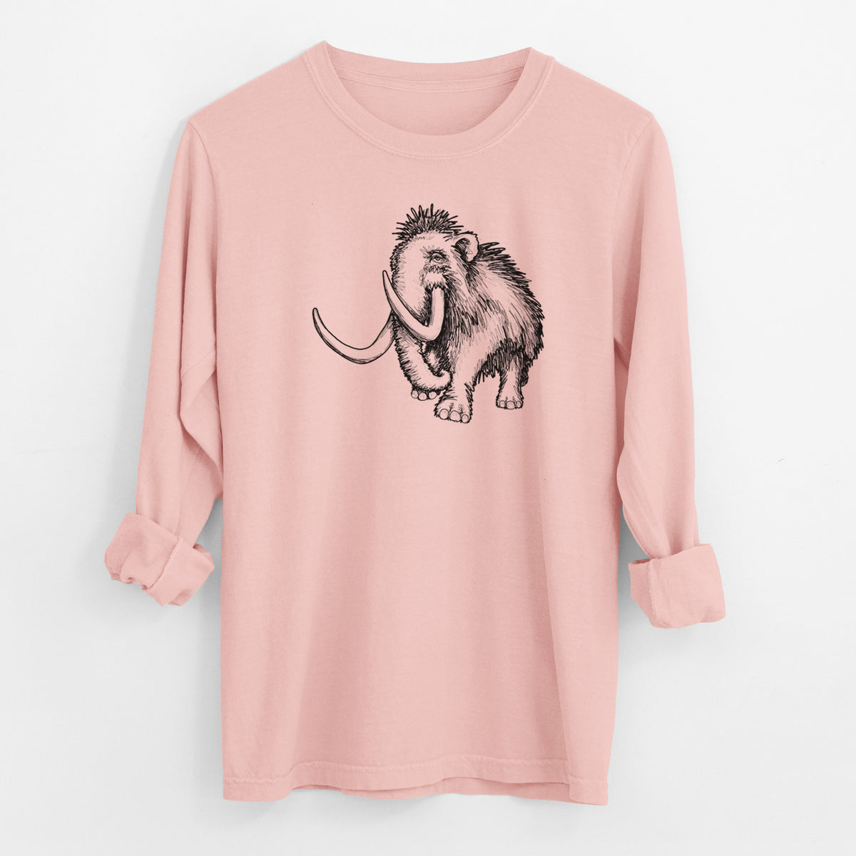 Peachy Comfort Colors long sleeve shirt laid flat with the cuffs rolled, printed with a black ink illustration of a woolly mammoth with long curved tusks.