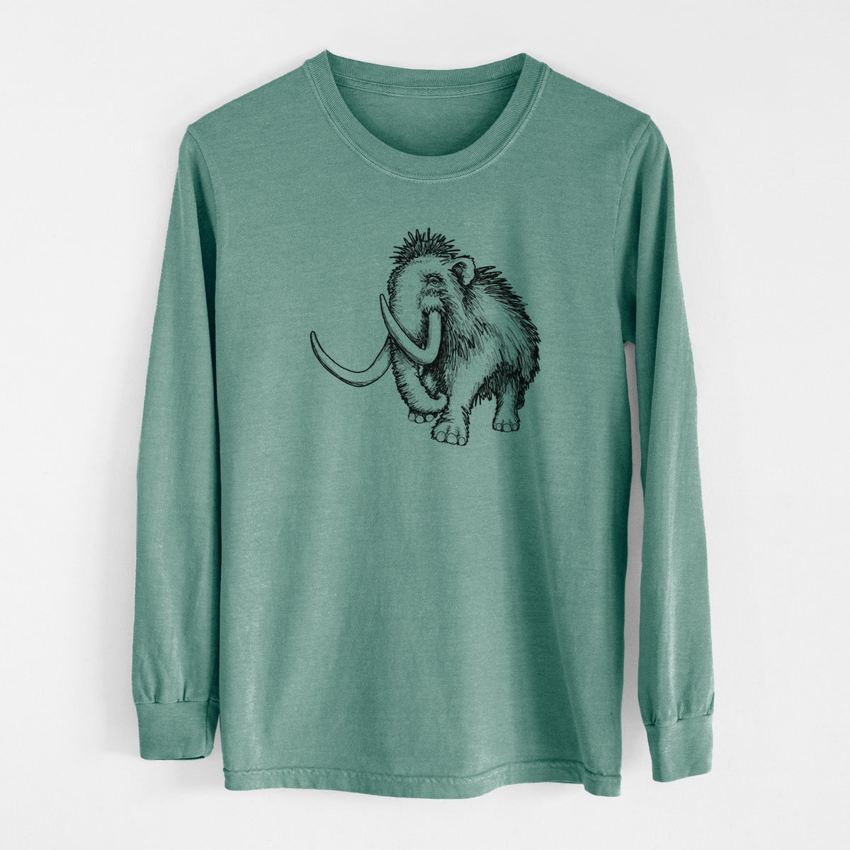 Pine green Comfort Colors long sleeve shirt laid flat, printed with a black ink illustration of a woolly mammoth with long curved tusks.