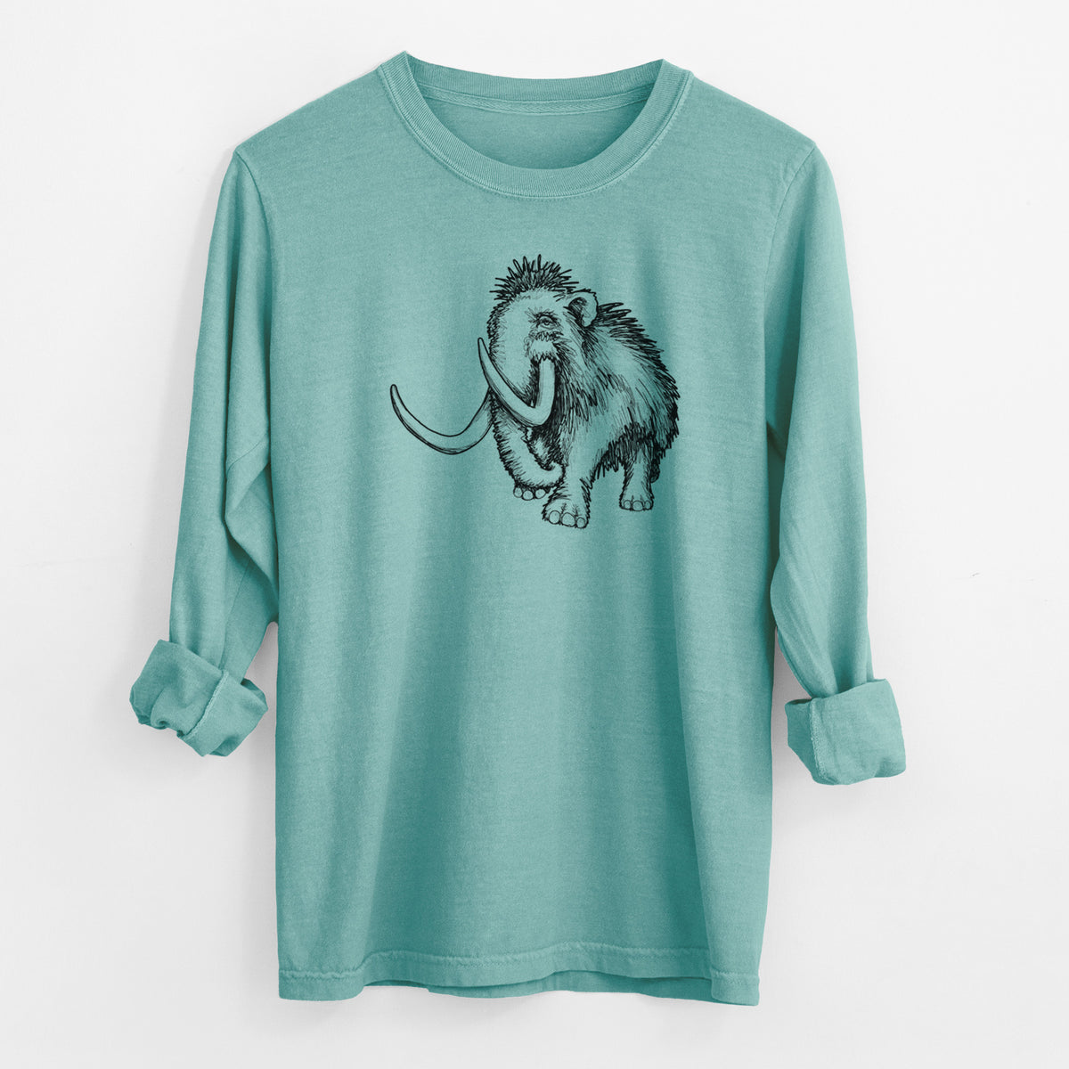 Reef green Comfort Colors long sleeve shirt laid flat with the cuffs rolled, printed with a black ink illustration of a woolly mammoth with long curved tusks.