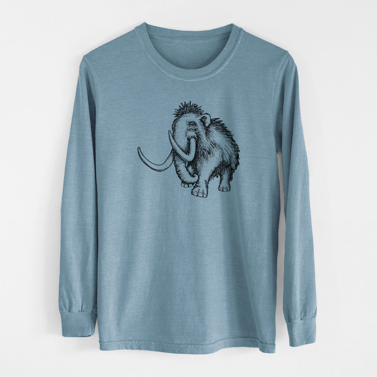 Steel blue Comfort Colors long sleeve shirt laid flat, printed with a black ink illustration of a woolly mammoth with long curved tusks.