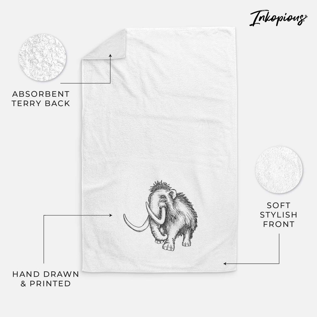 White hand towel printed with a black ink illustration of a woolly mammoth with long curved tusks.