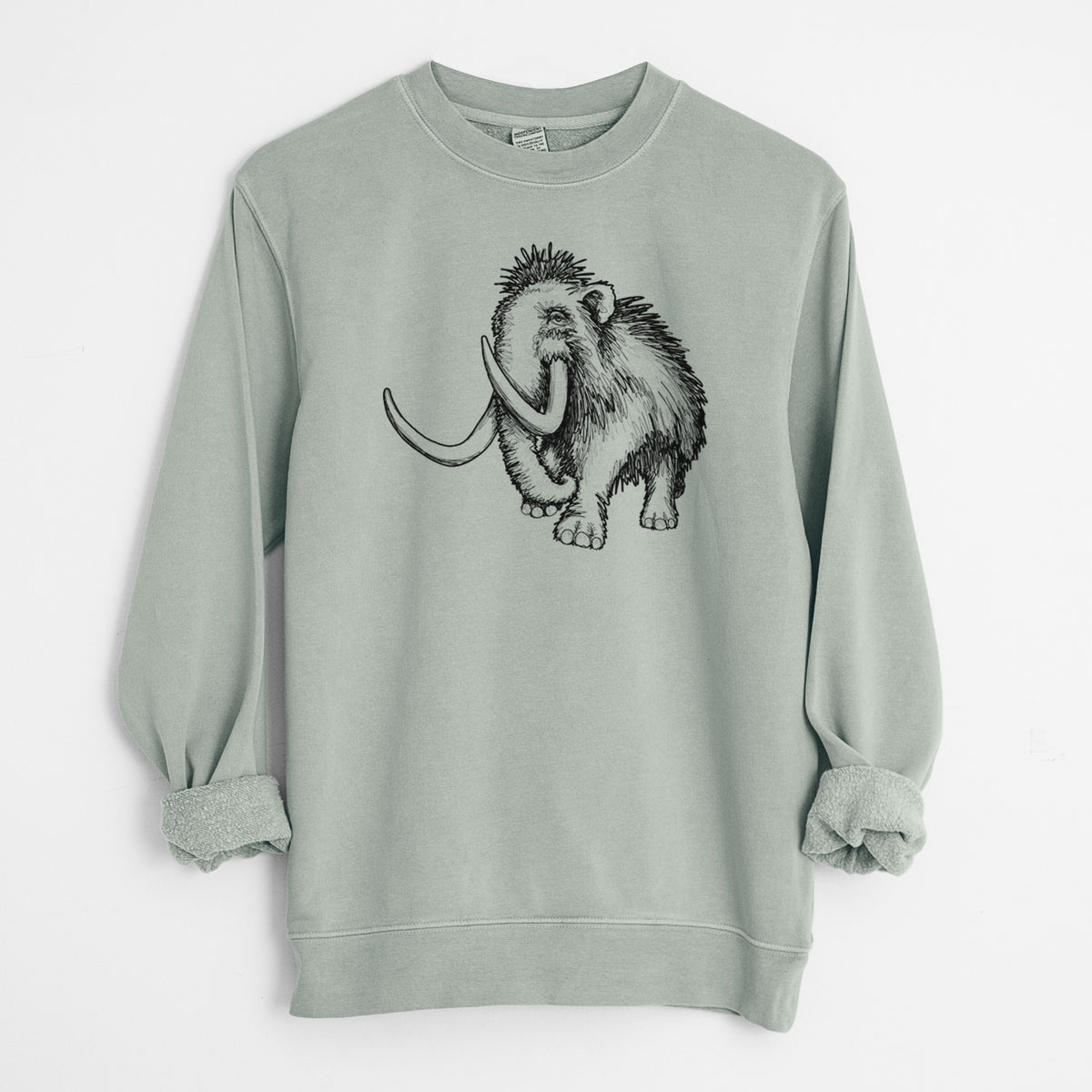 Sage green pigment dyed crewneck sweatshirt laid flat with the sleeves rolled, printed with a black ink illustration of a woolly mammoth with long curved tusks.