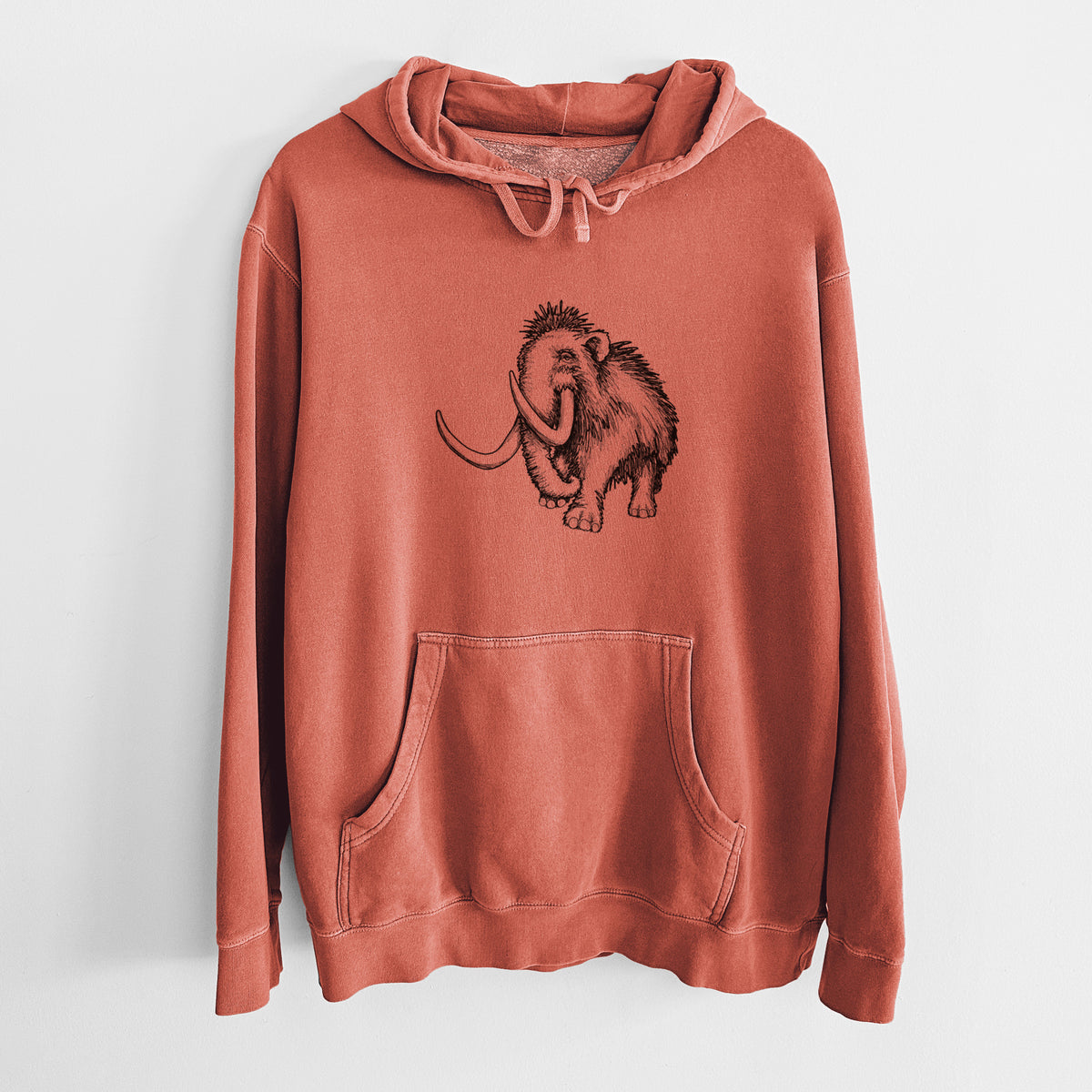 Amber orange pigment dyed hoodie laid flat, printed with a black ink illustration of a woolly mammoth with long curved tusks.