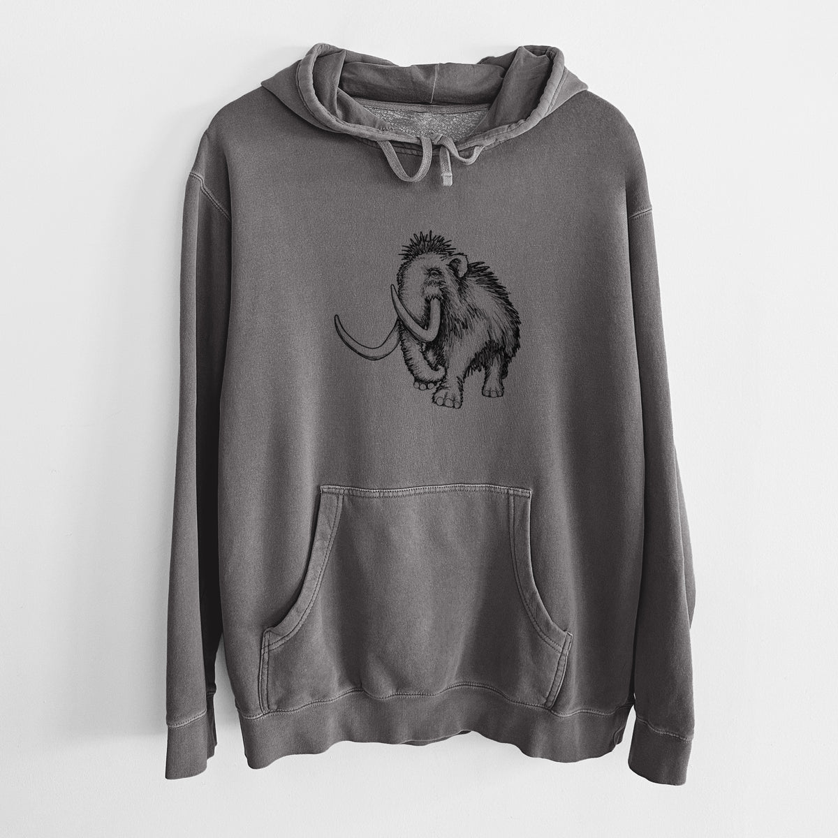 Faded black pigment dyed hoodie laid flat, printed with a black ink illustration of a woolly mammoth with long curved tusks.