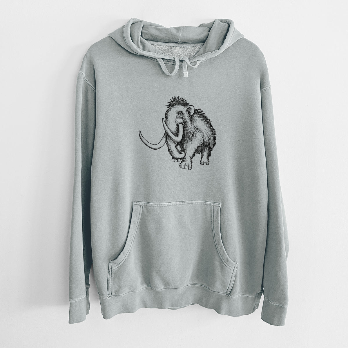 Sage green pigment dyed hoodie laid flat, printed with a black ink illustration of a woolly mammoth with long curved tusks.